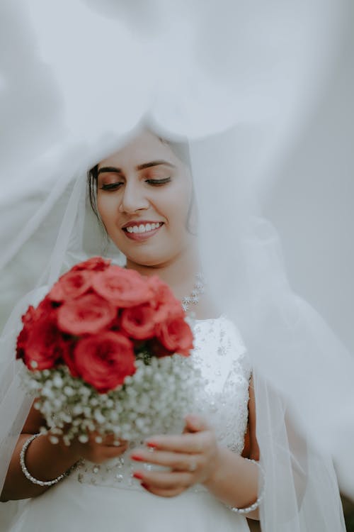 Bride with Bouquet under Veil
