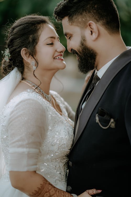 Smiling and Hugging Newlyweds