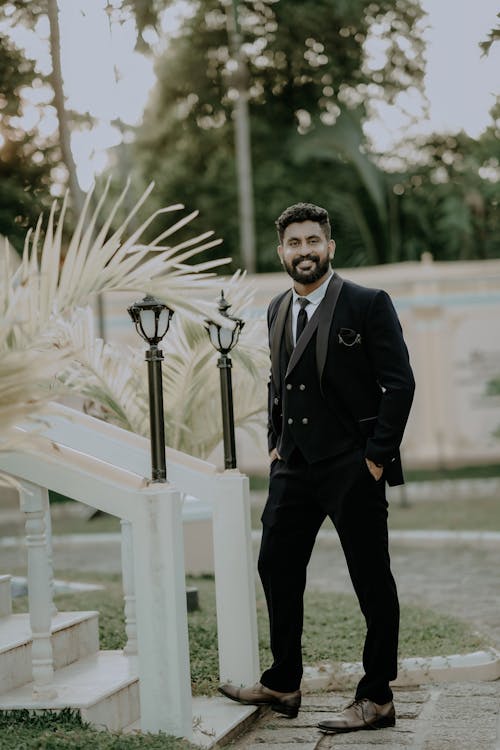 A man in a suit standing outside