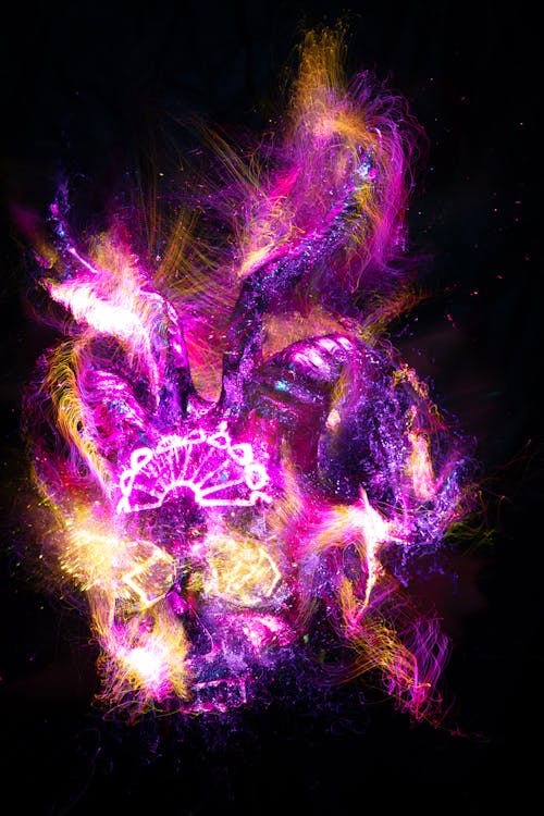 A purple and pink glowing skull with a glowing light