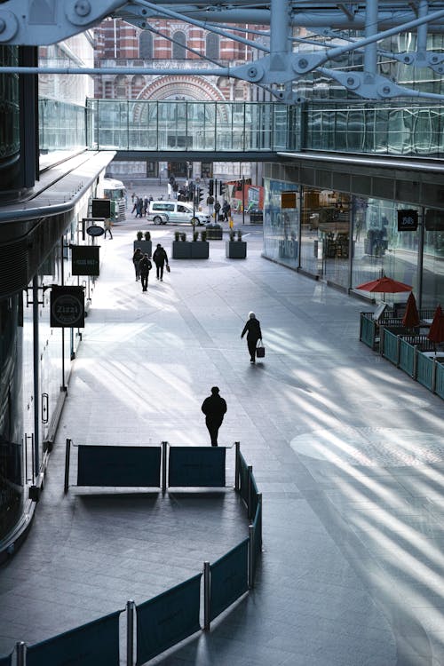 People walking through an airport terminal