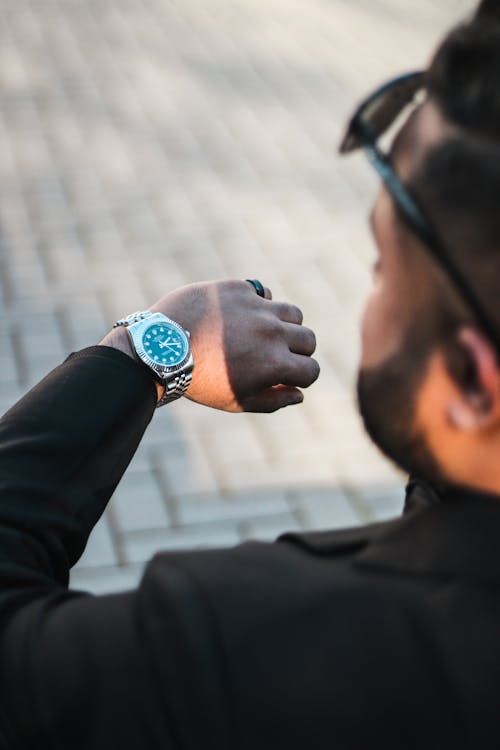 A man wearing a suit and a watch