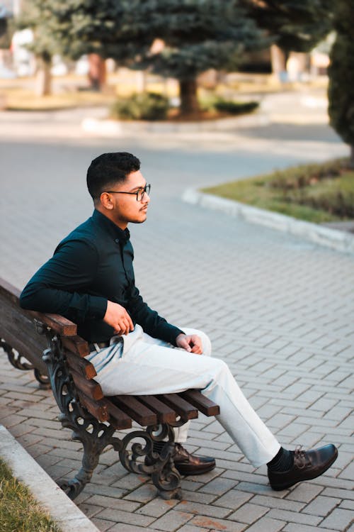 Elegant Man Sitting on Bench