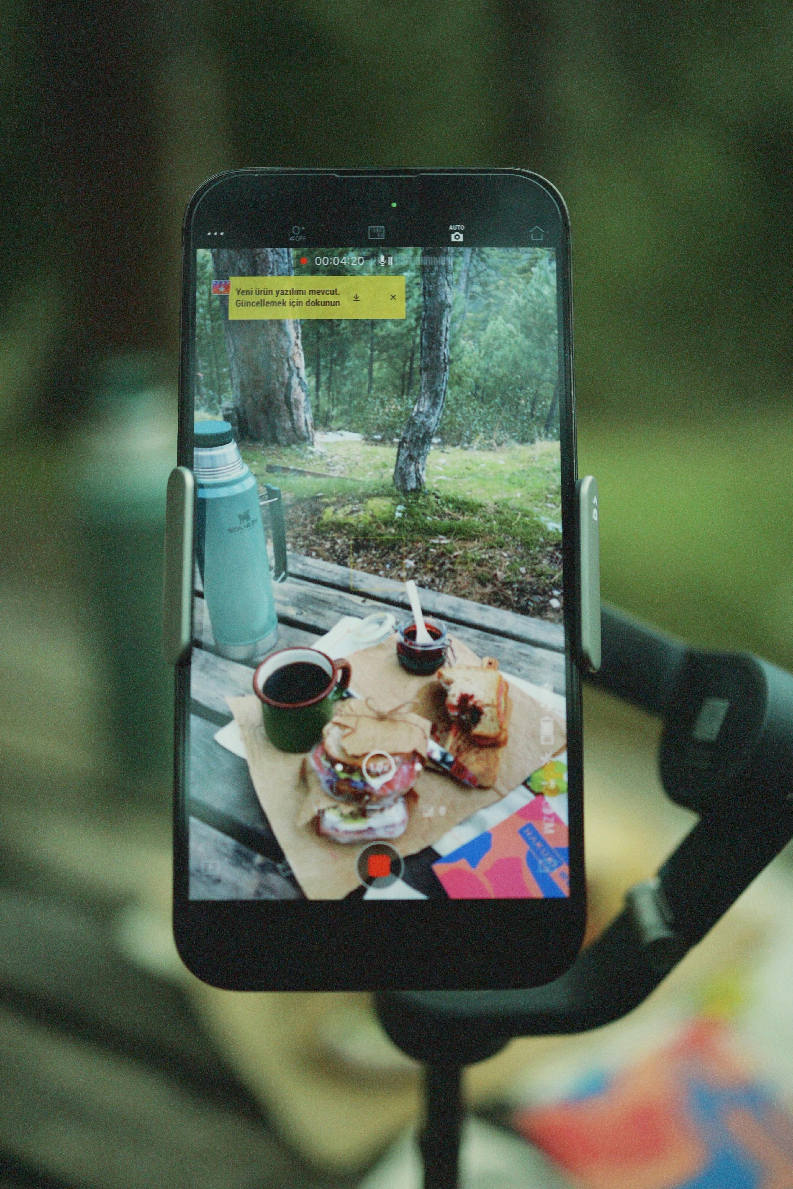 recording table in forest with smartphone