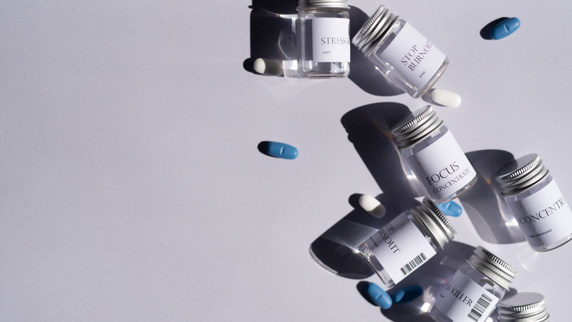 Modafinil for Mental Clarity: Sharpen Your Mind Still life of assorted pills and labeled bottles, perfect for healthcare themes.
