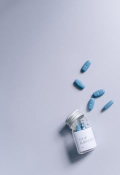 Creative conceptual photo of pills labeled 'Stop Burnout' on a gray surface, top view.
