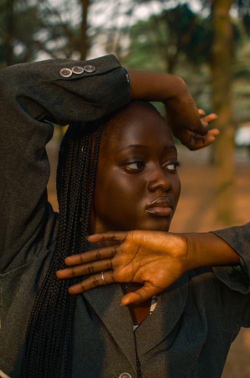 Free Fashion-forward portrait of a woman outdoors with expressive pose in Ibadan, Nigeria. Stock Photo