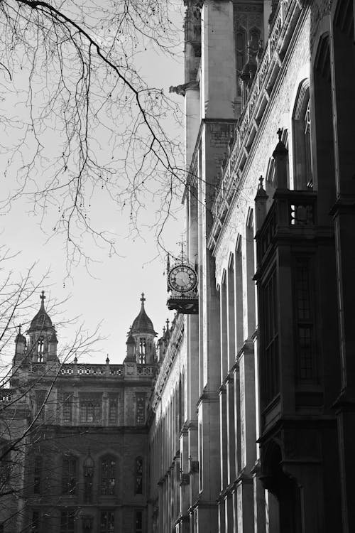 Black and white photo of a building with a clock tower