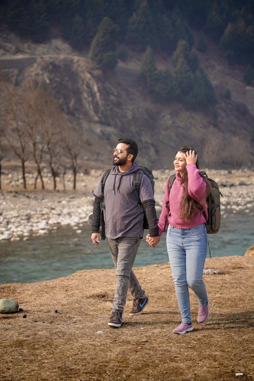 Couple Hiking by River