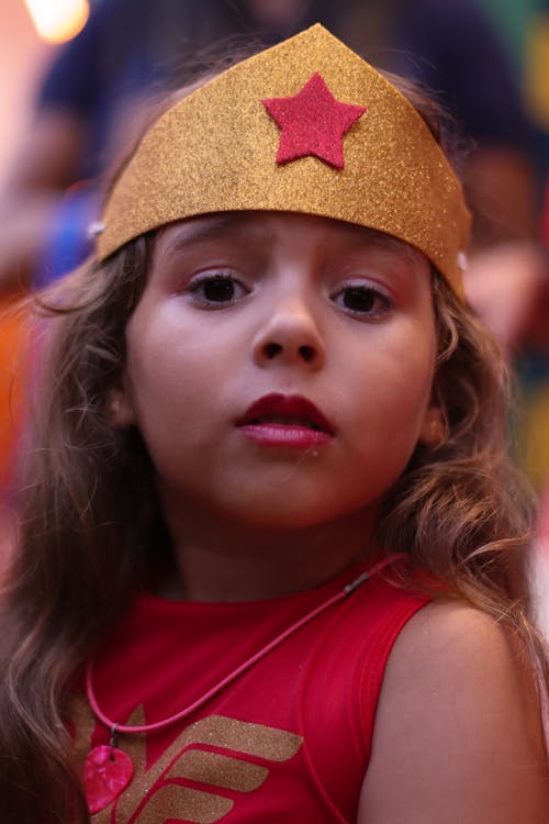 A little girl dressed as wonder woman