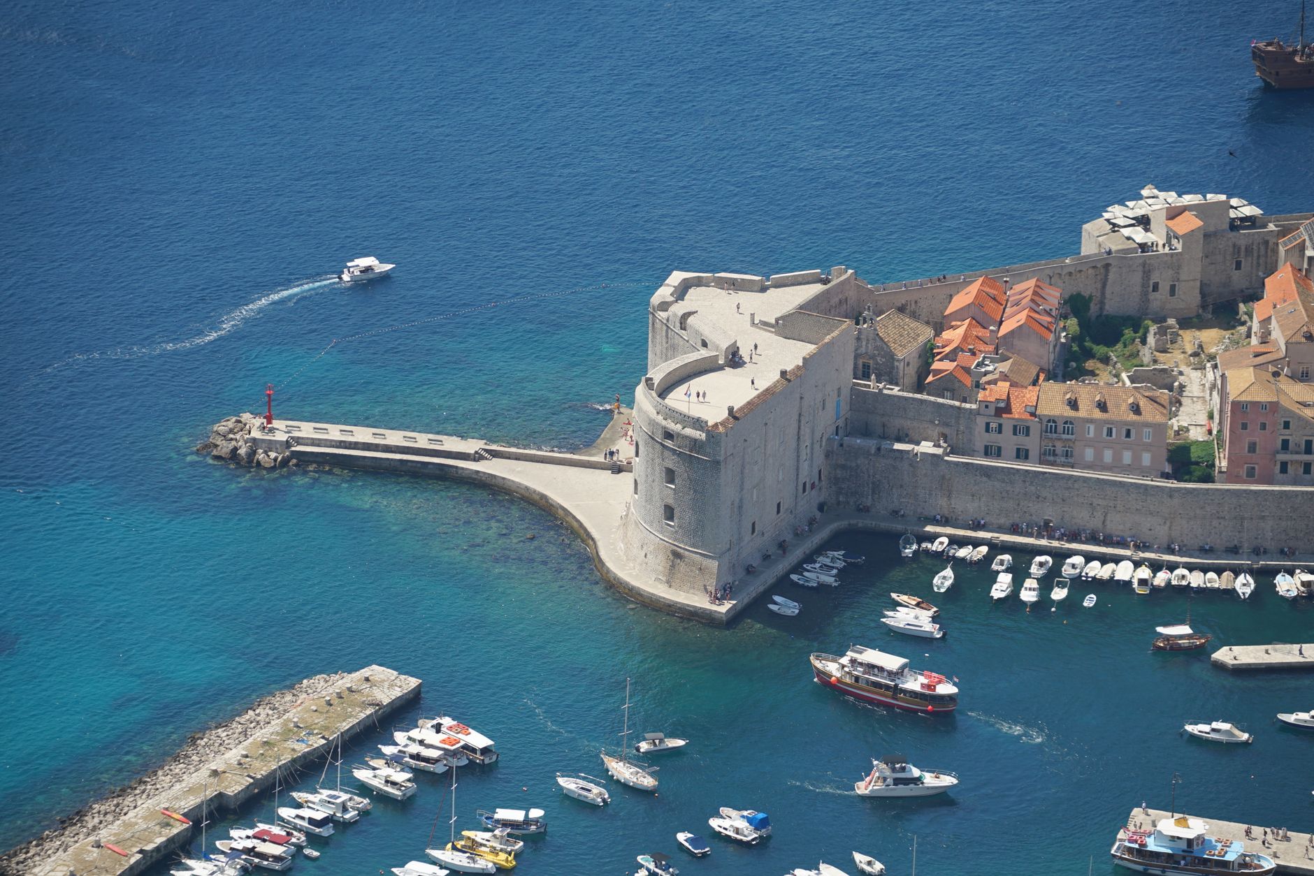 Empty morning street inside Dubrovnik's Old Town walls in shoulder season light