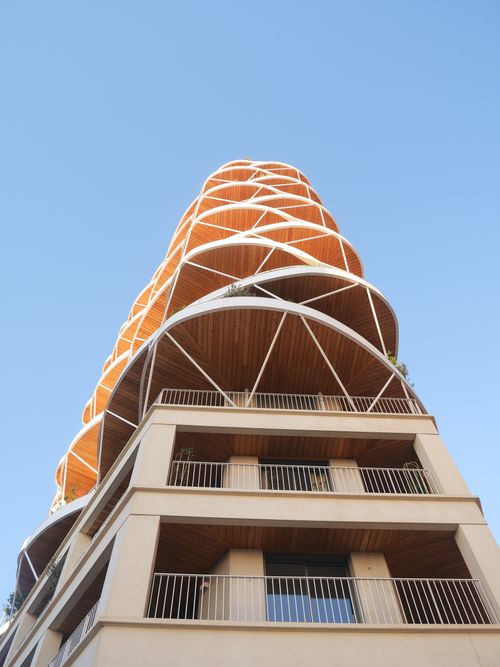 Free Low-angle view of a modern architectural building under a clear blue sky in Montpellier, France. Stock Photo