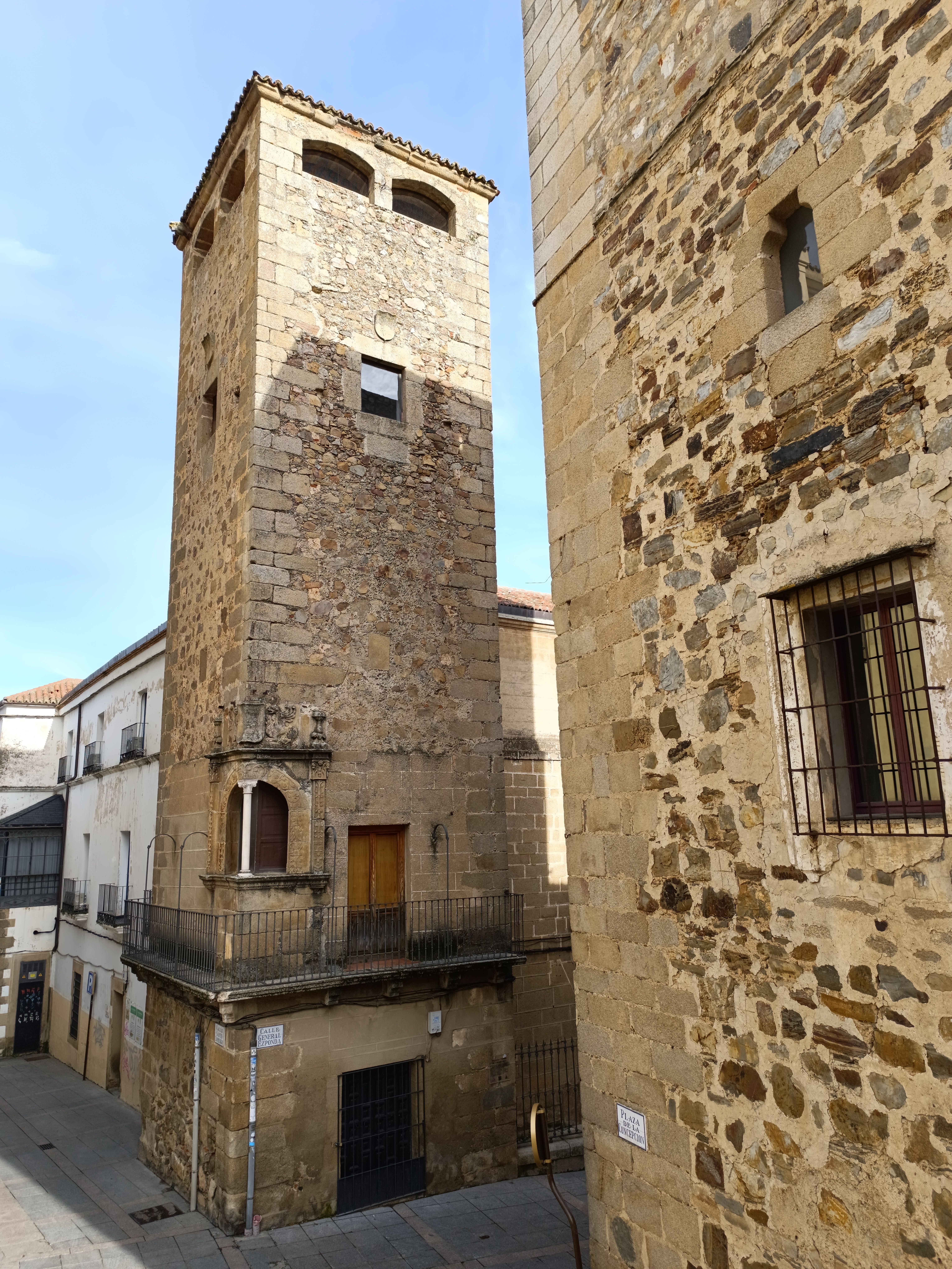 Ancient stone towers in Caceres, Spain, showcasing medieval architecture.
