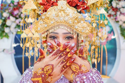 Portrait of Bride in Golden Crown and with Henna Tattoos