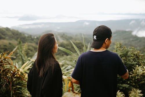 Free A man and woman looking out over the mountains Stock Photo