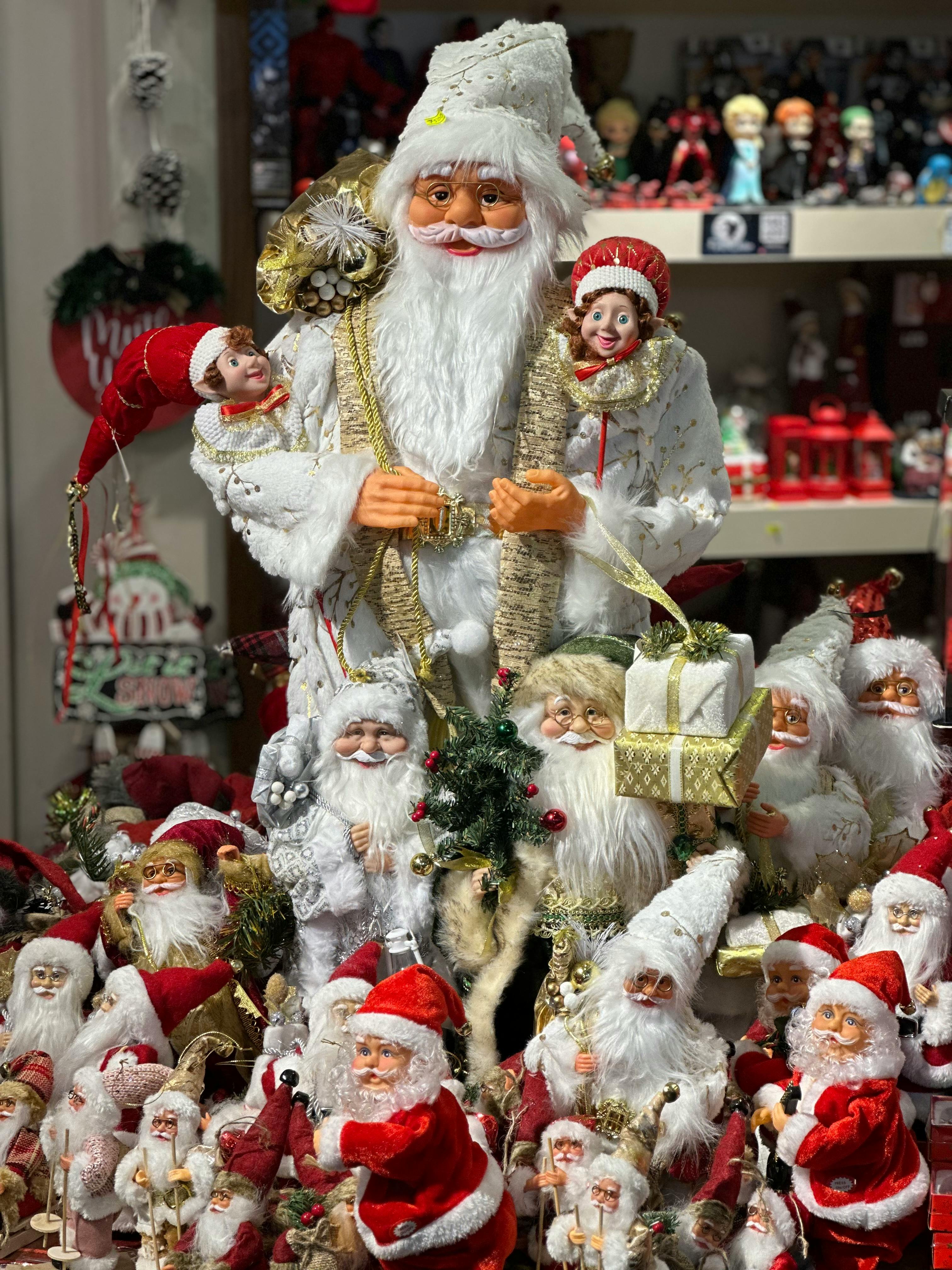 A display of santa claus and his helpers · Free Stock Photo