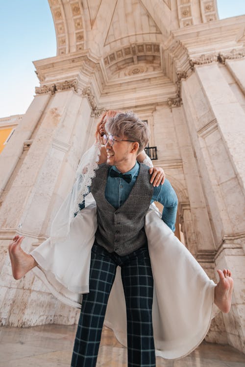 Man Carrying his Bride in Piggyback