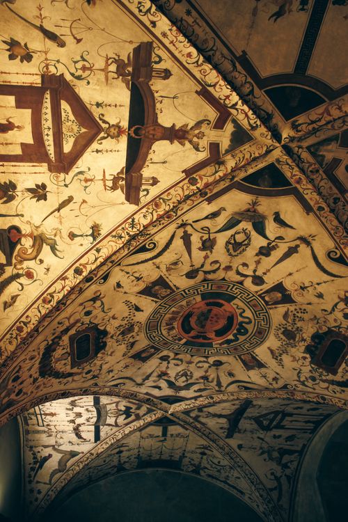 Free Detailed view of an ornate frescoed ceiling in the historic Palazzo Vecchio, showcasing Renaissance art. Stock Photo