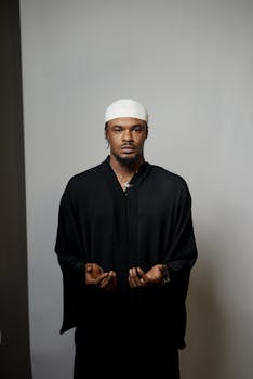 Serene portrait of a man meditating indoors, capturing a moment of peace and reflection.