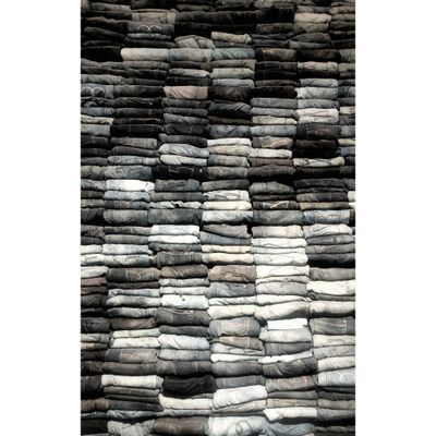 Stack of folded denim jeans, photo by Filiz Yıldız on Pexels
