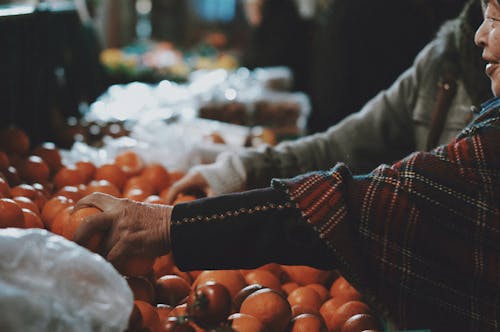 People Hands Taking Fruit at Bazaar