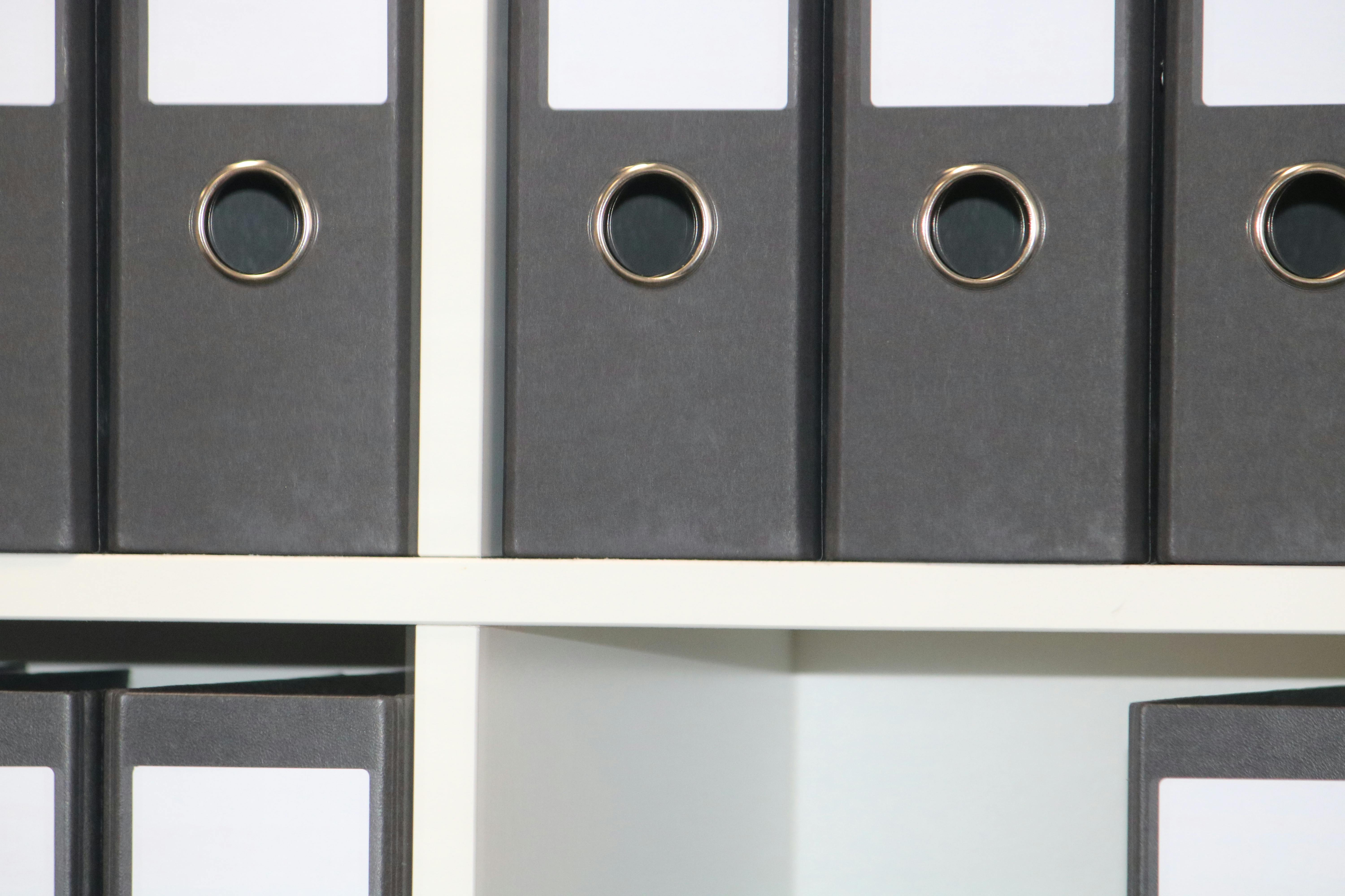 Jars of kimchi and fermented vegetables on a wooden table