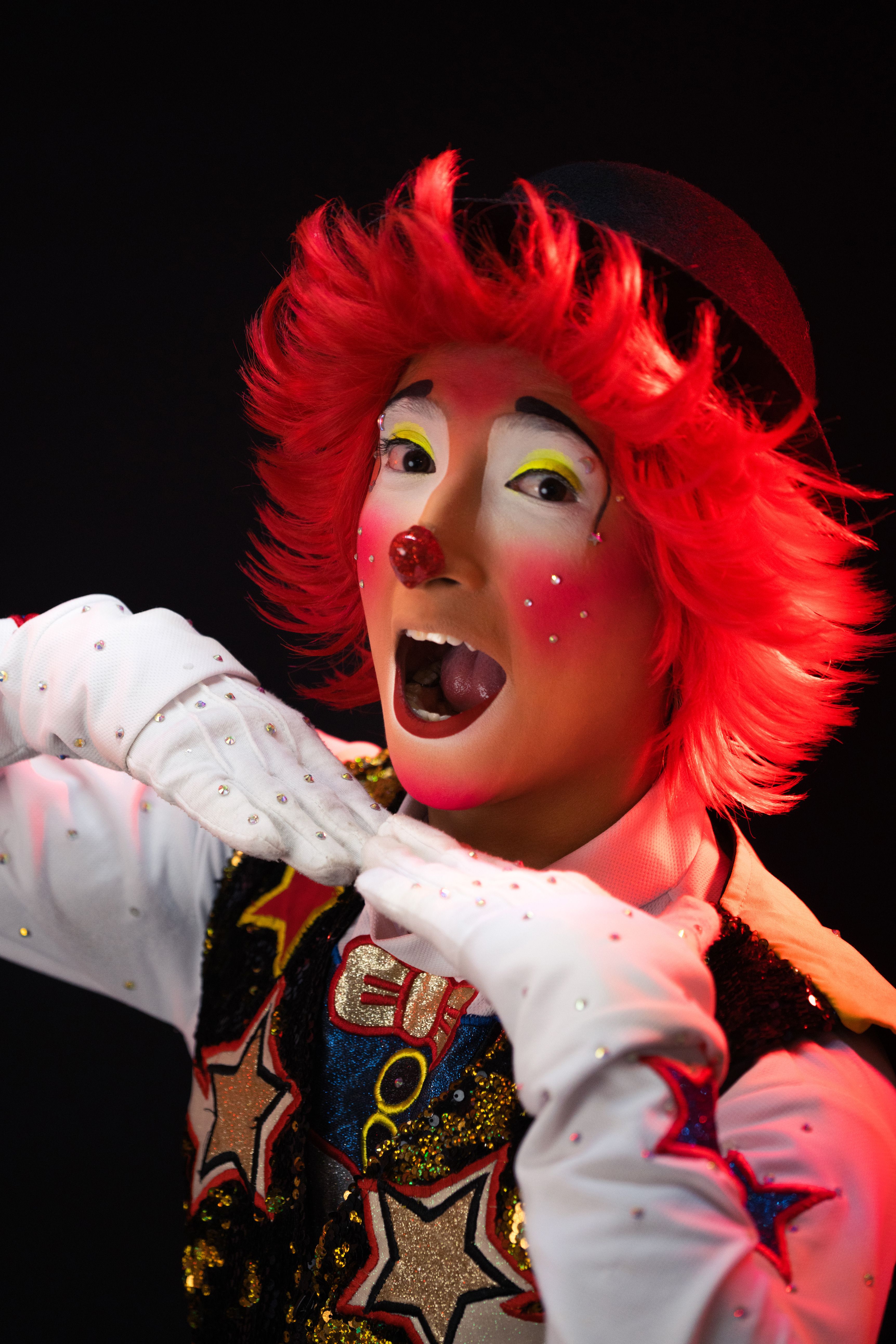 A clown with red hair and red makeup · Free Stock Photo