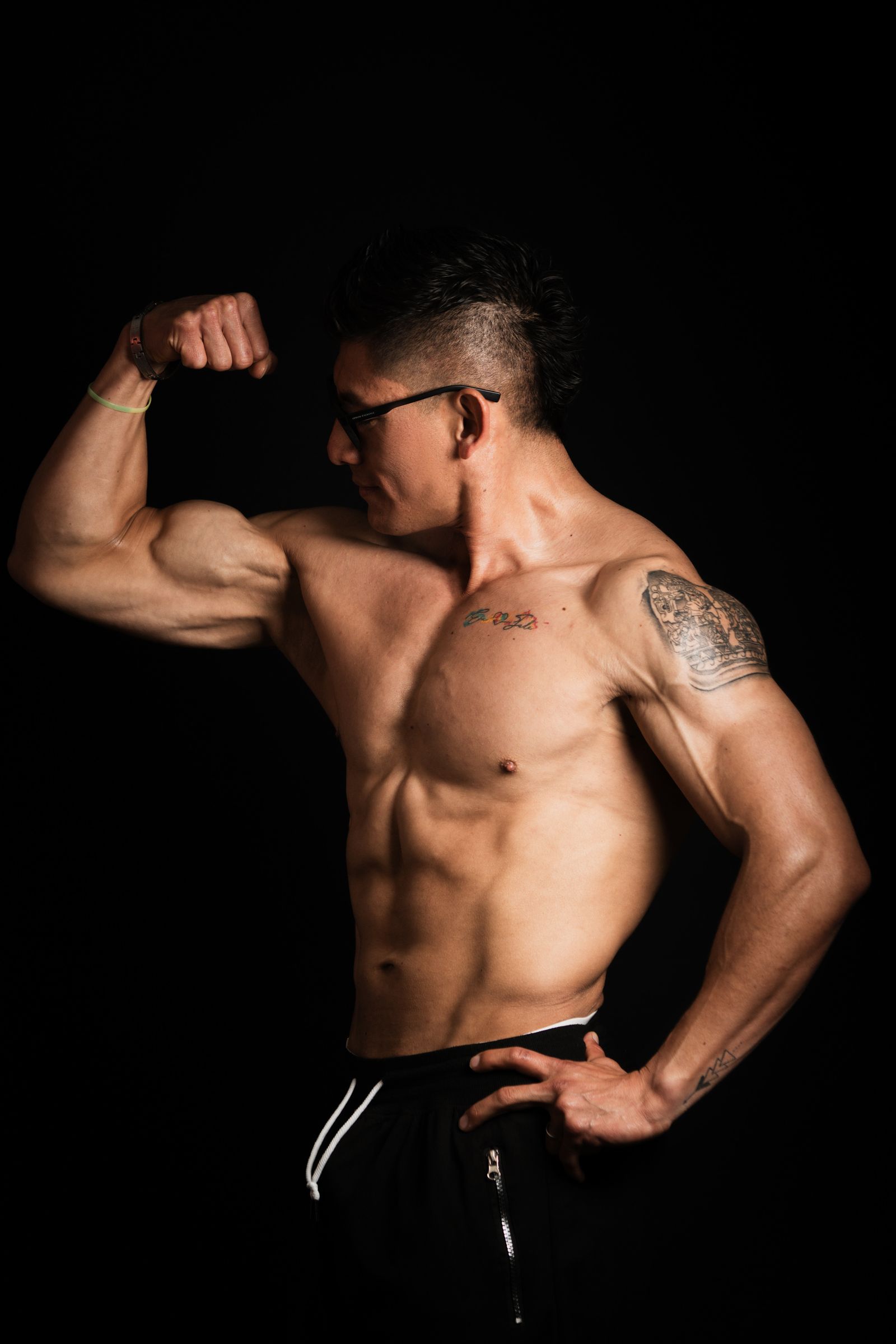 Shirtless Man Flexing His Muscles · Free Stock Photo