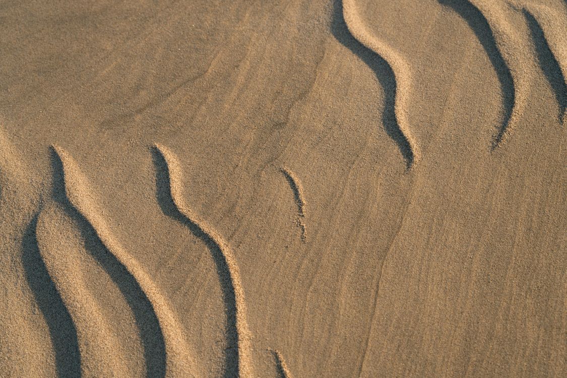 Pin Shape Sand Shapes on Beach Sand · Free Stock Photo