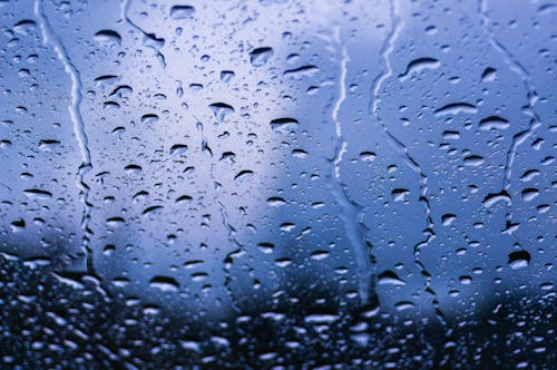 A close up of rain drops on a window