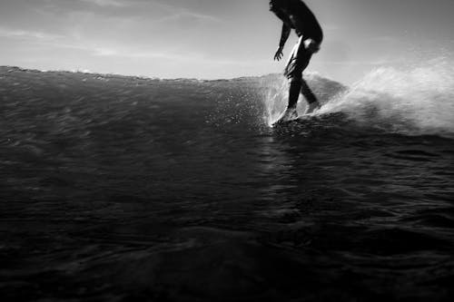 Surfer on Sea Shore in Black and White