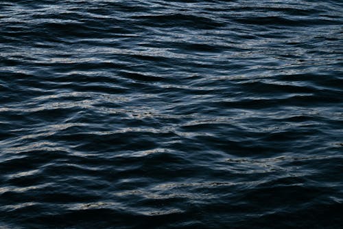Waves on Dark Sea