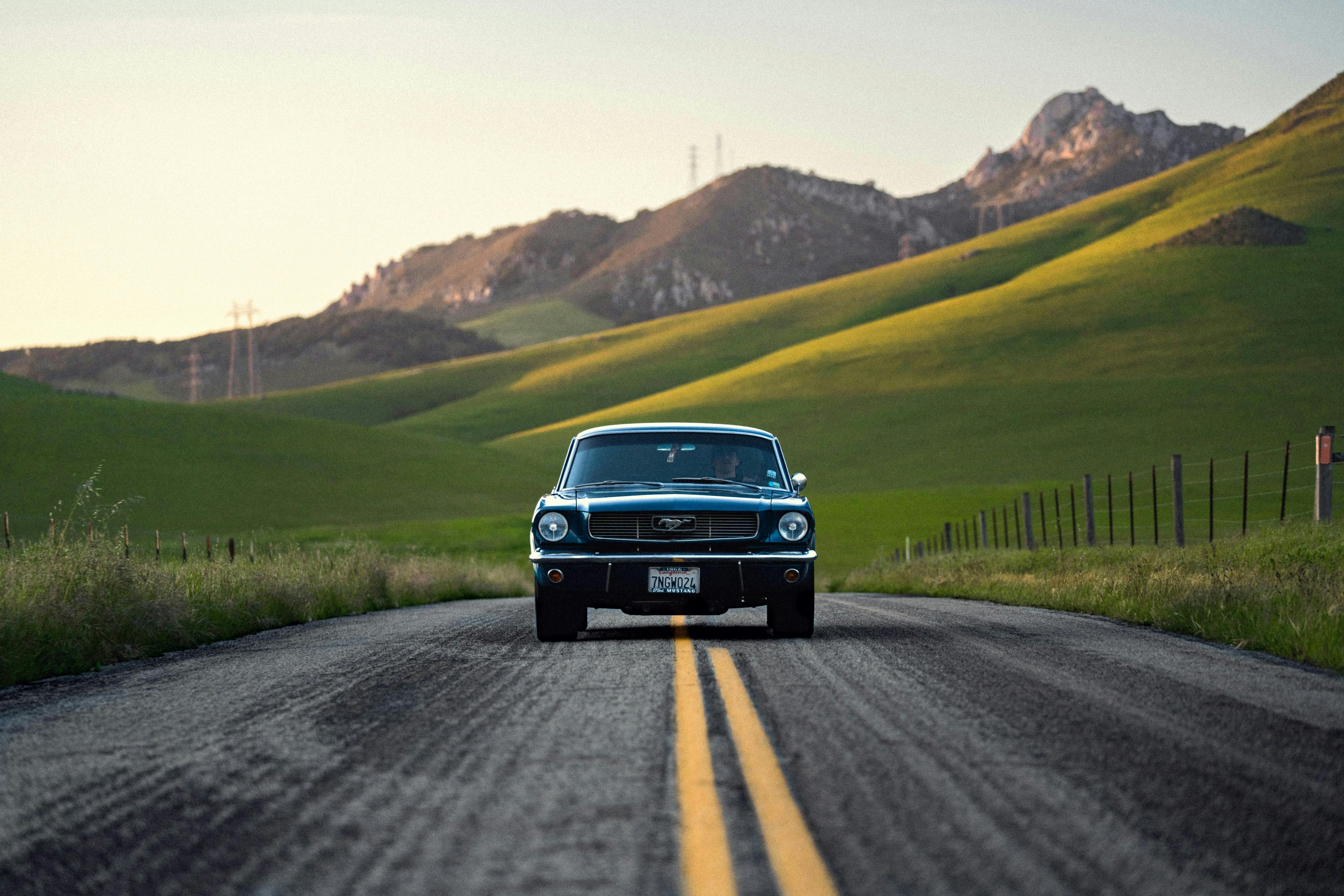 old fashioned car on rural road