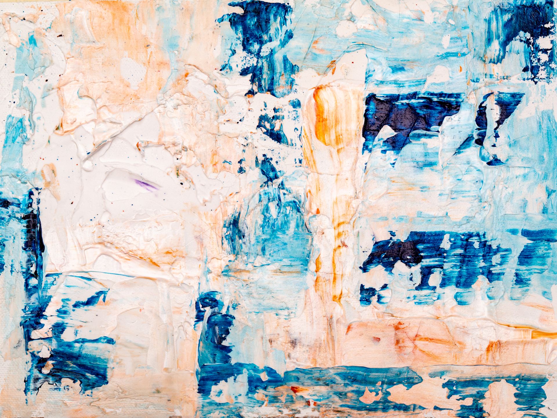 Colorful abstract acrylic painting with blue and orange textures on canvas.