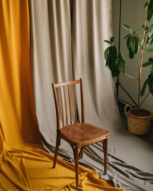 Wooden Chair on White and Yellow Background