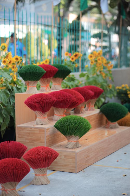 Incense Sticks and Flowers behind