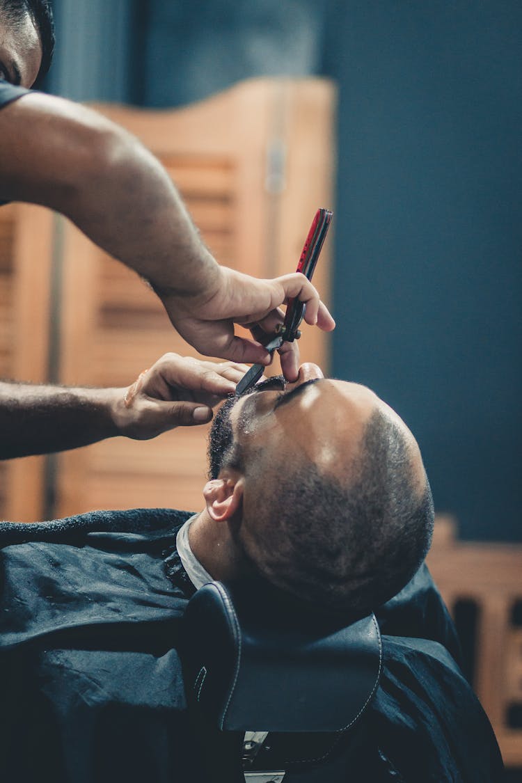 Person Shaving Beard