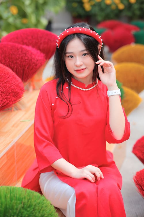 Woman Sitting in Red, Traditional Dress