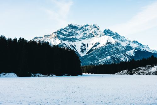 Free Beautiful snow-covered mountain and frozen lake landscape in Banff, Canada. Stock Photo
