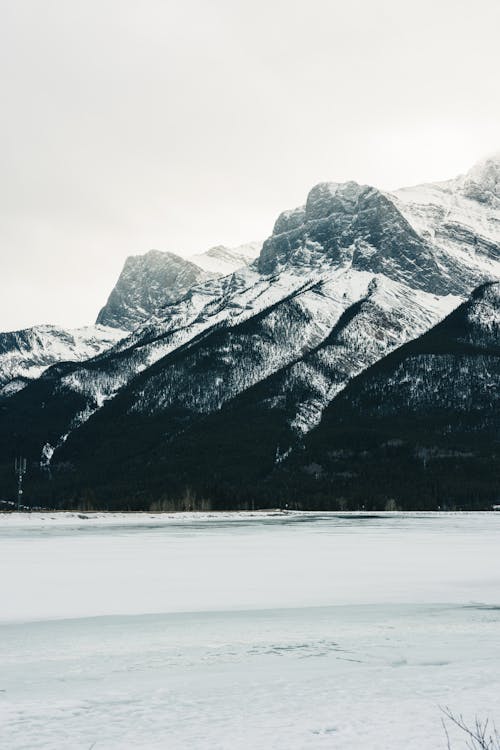 Frozen Lake and Mountain behind in Winter