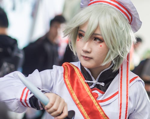 Woman Wearing White and Orange Costume