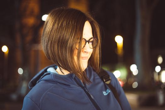 A professional stylist performing a precise blunt bob haircut on a client.