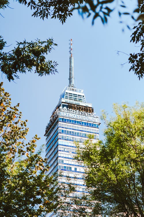 A tall building with trees in the background