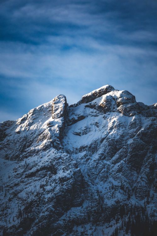 Free Stunning view of snow-capped mountains under a clear blue sky, perfect for winter themes. Stock Photo
