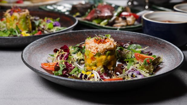 Close-up of a gourmet salad dish garnished beautifully, perfect for a fine dining experience.