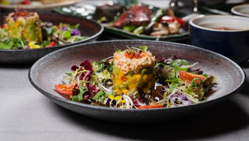 Free Close-up of a gourmet salad dish garnished beautifully, perfect for a fine dining experience. Stock Photo