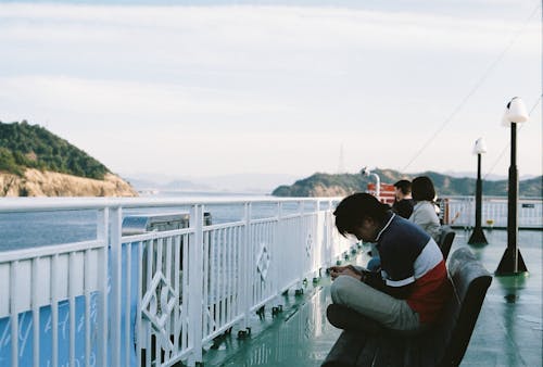 People Sitting on a Pier