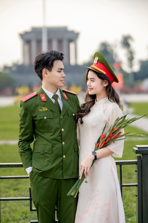 A young man and woman in military uniforms