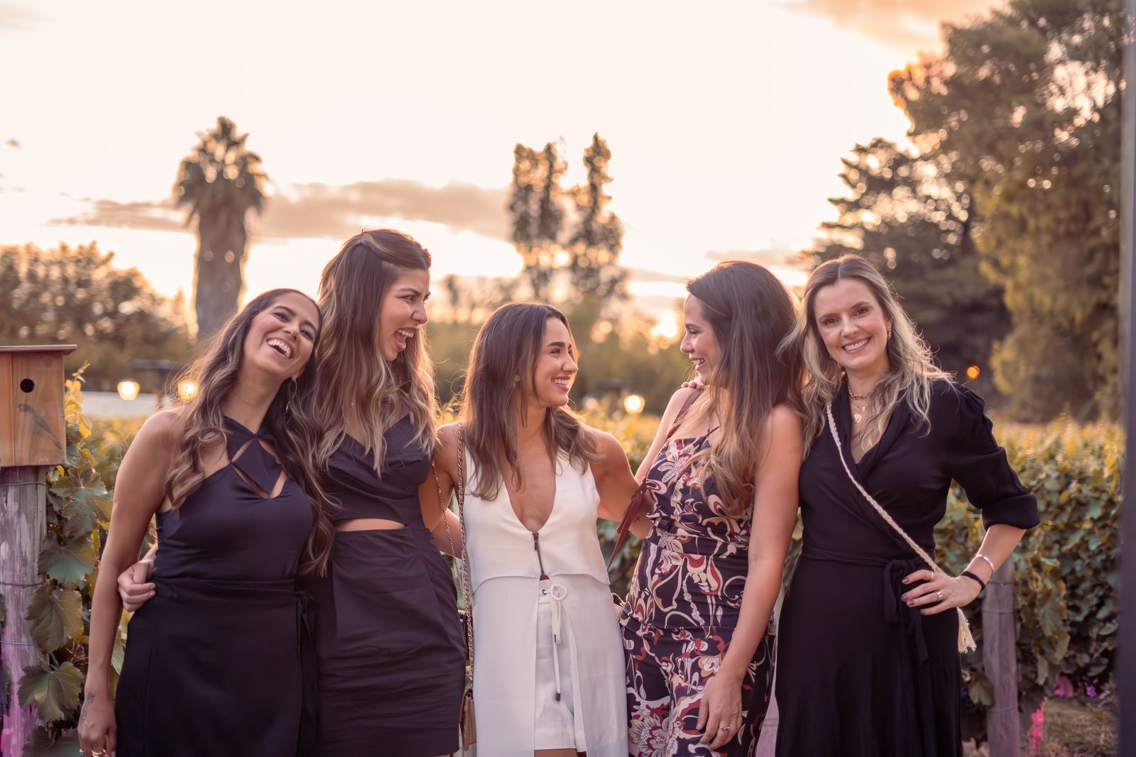 Group of smiling women dressed up for a bachelorette night out