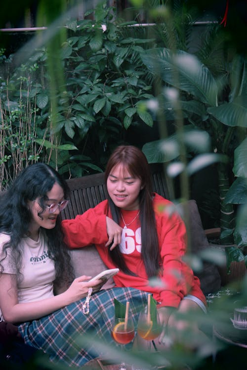 Women Sitting in a Tropical Garden